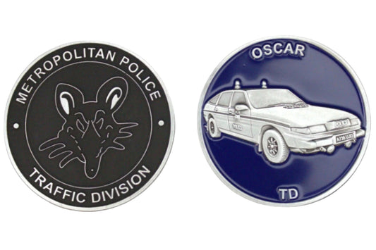 Two round badges, one for Metropolitan Police Traffic Division and the other for Oscar with a car illustration, on a dark gray background.