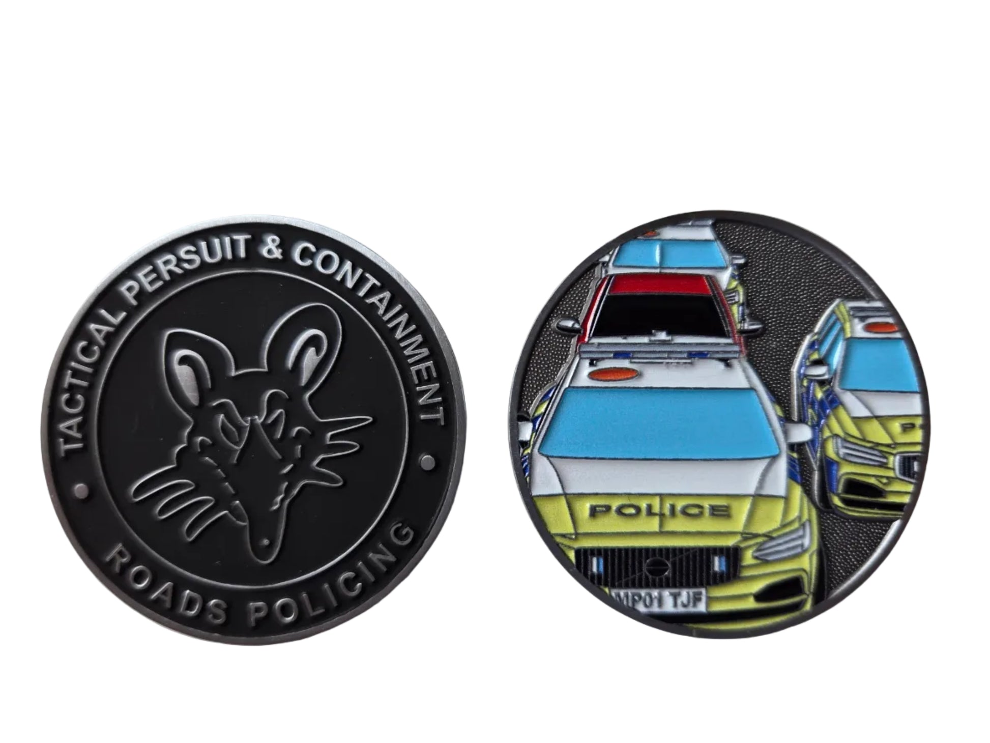 Two circular police-themed challenge coins displayed side by side on a light gray surface. The left coin is dark metallic gray with an embossed rat logo and the text 'TACTICAL PERSUIT & CONTAINMENT' and 'ROADS POLICING'.